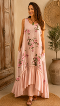 Front view of blush pink floral sleeveless maxi dress with pockets and tiered hem